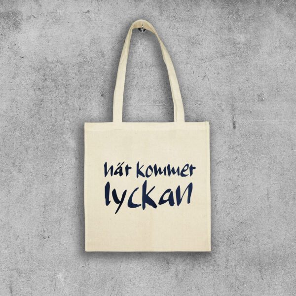 Tygpåse Här kommer lyckan
